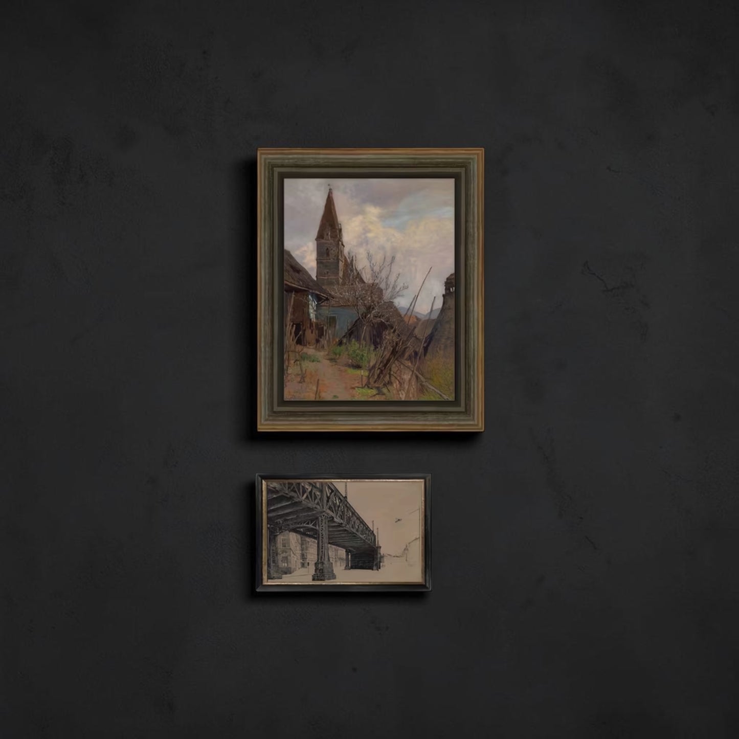Two framed artworks on a dark wall