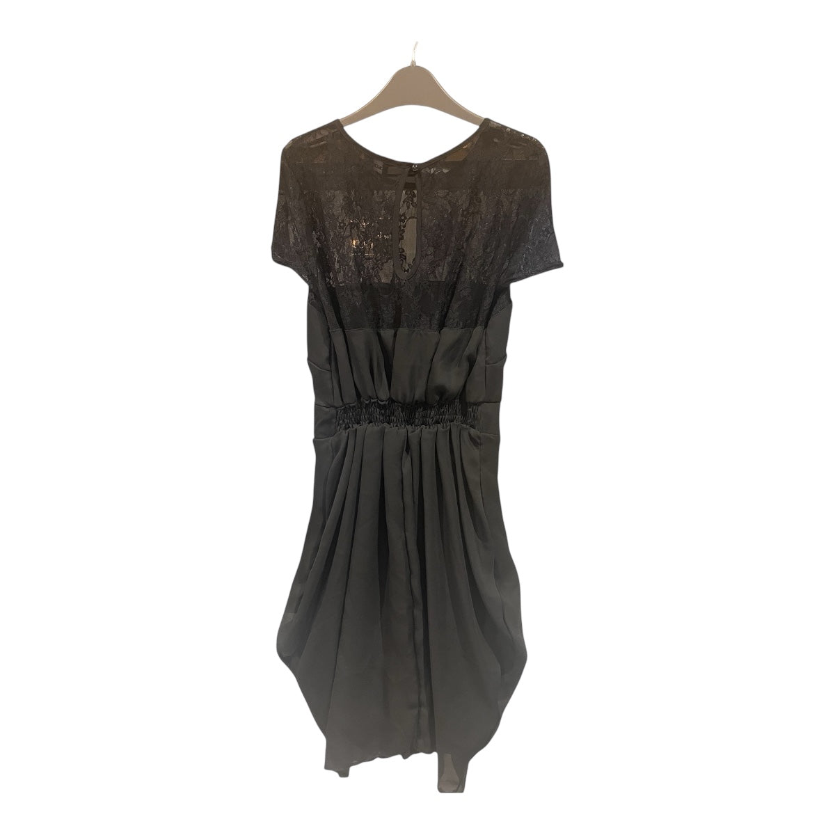 Black dress on a hanger against a white background