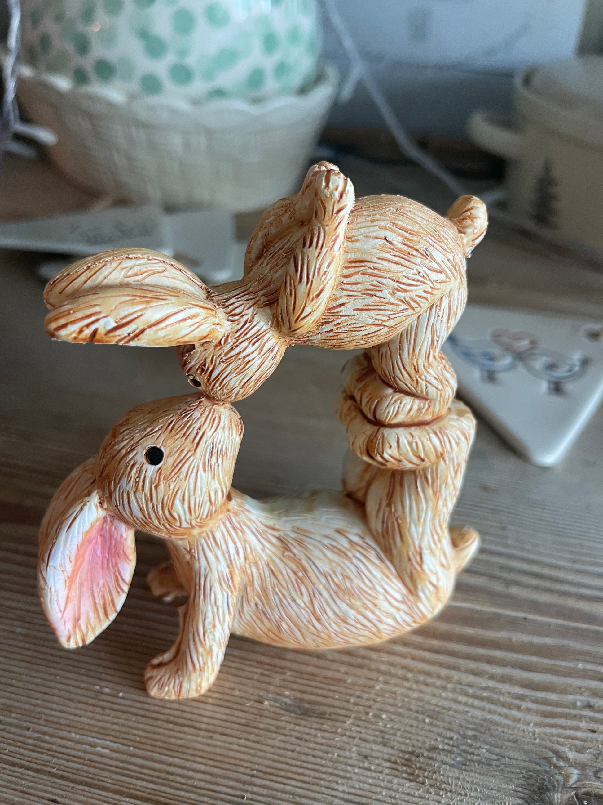 Decorative squirrel figurine on a wooden surface