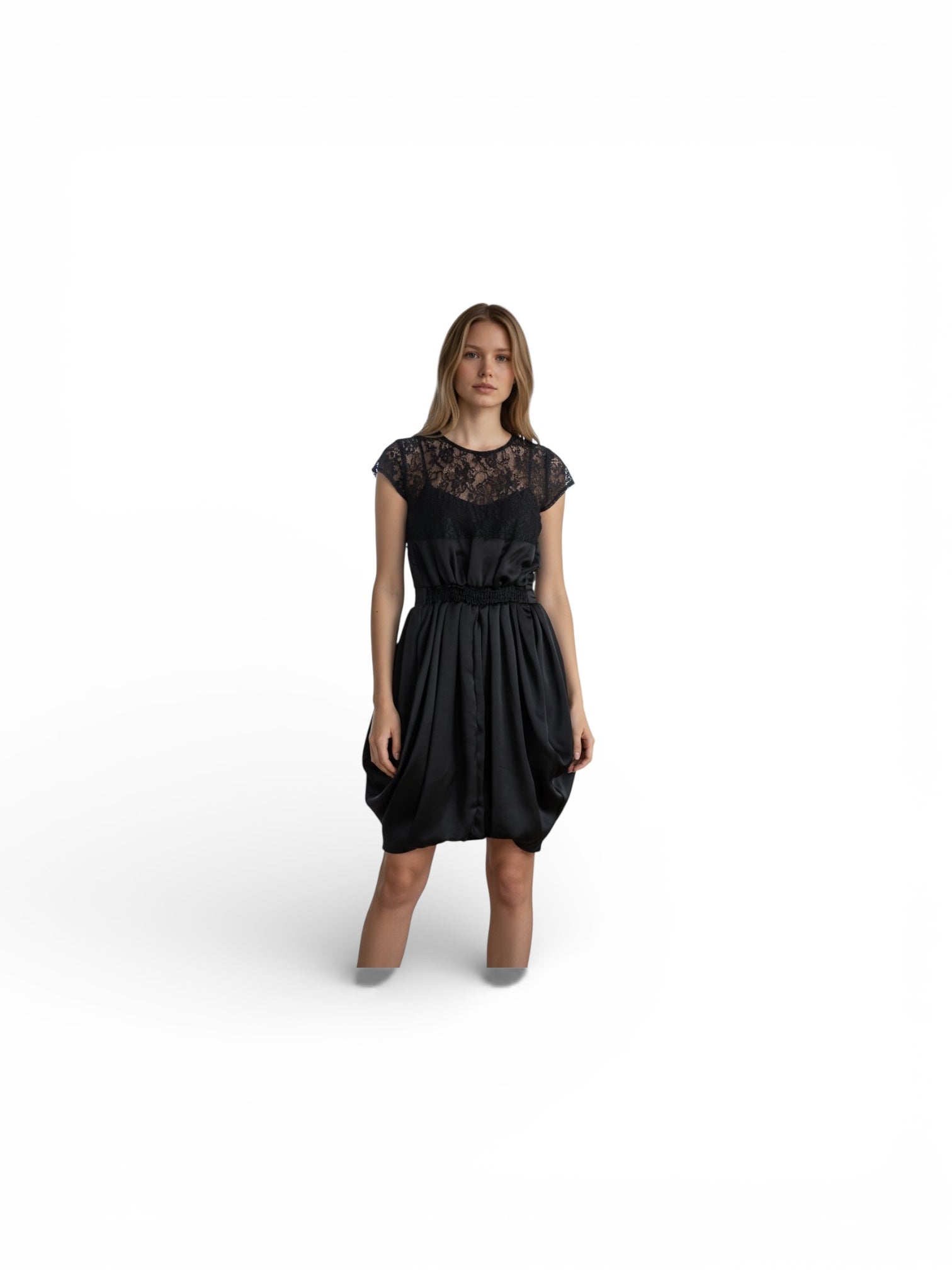 Woman wearing a black dress with lace details on a white background