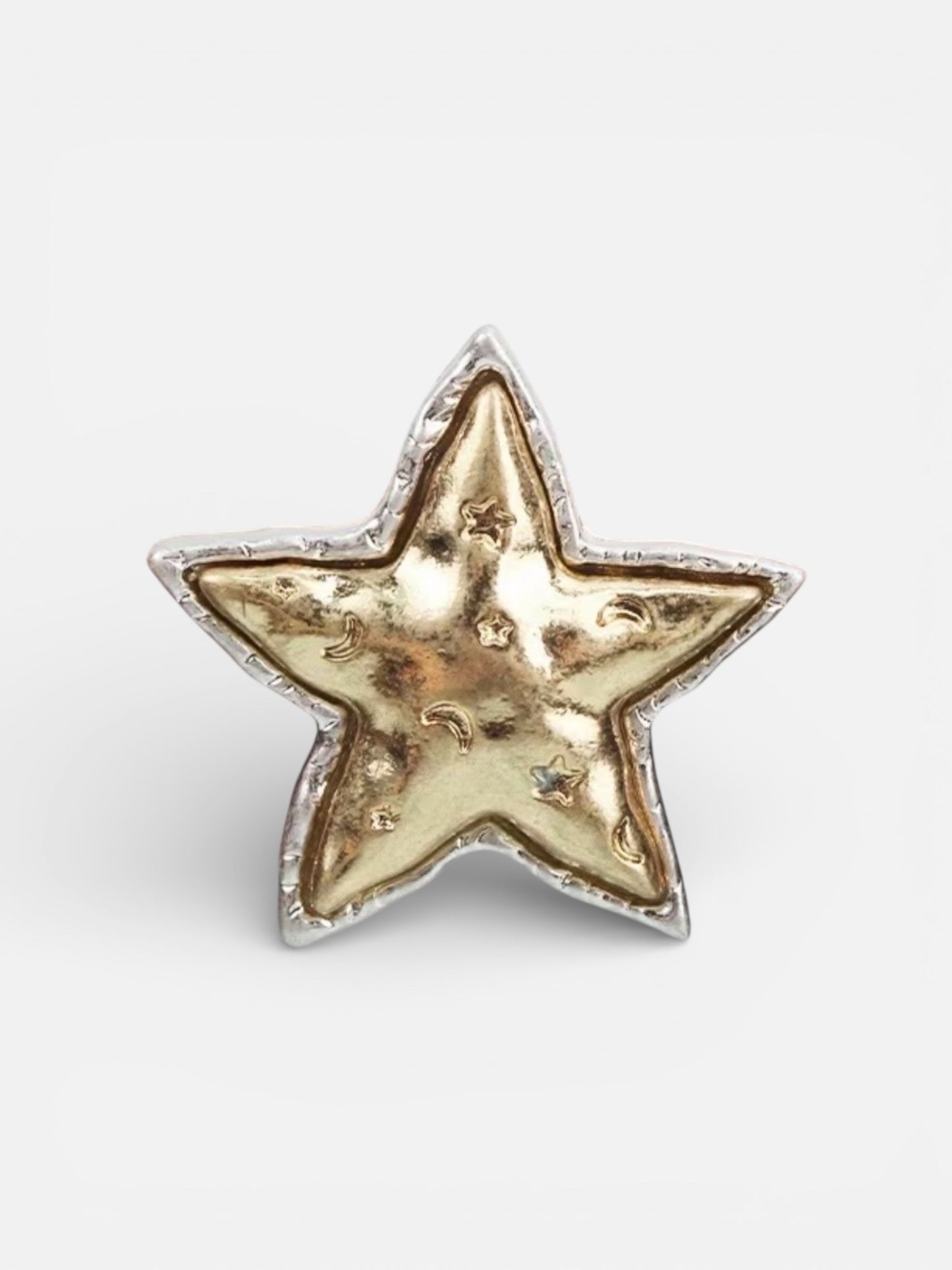 Gold star-shaped object on a white background