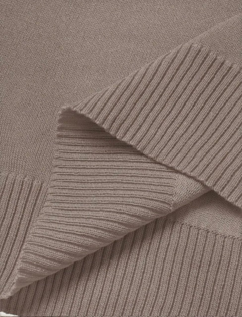 Close-up of ribbed fabric in a neutral brown color