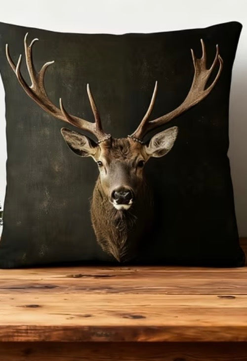 Decorative pillow with a deer design on a wooden surface