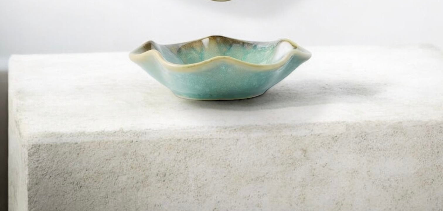 Green ceramic bowl on a white surface
